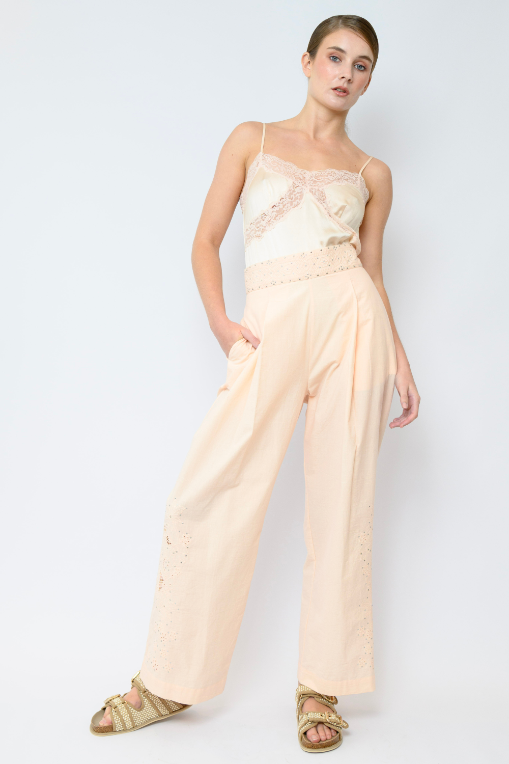 Soft pink silk satin camisole with lace trim and spaghetti straps, featuring a peep through lace design under the bust. 20% off storewide sale