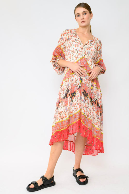 Kasana Freddie Tiered Dress on sale – silk crinkle patchwork florals in lilac, coral and pink hues with silver buttons, hand-beaded tassel tie, elasticised sleeves, high-low hem, and separate cotton bodice