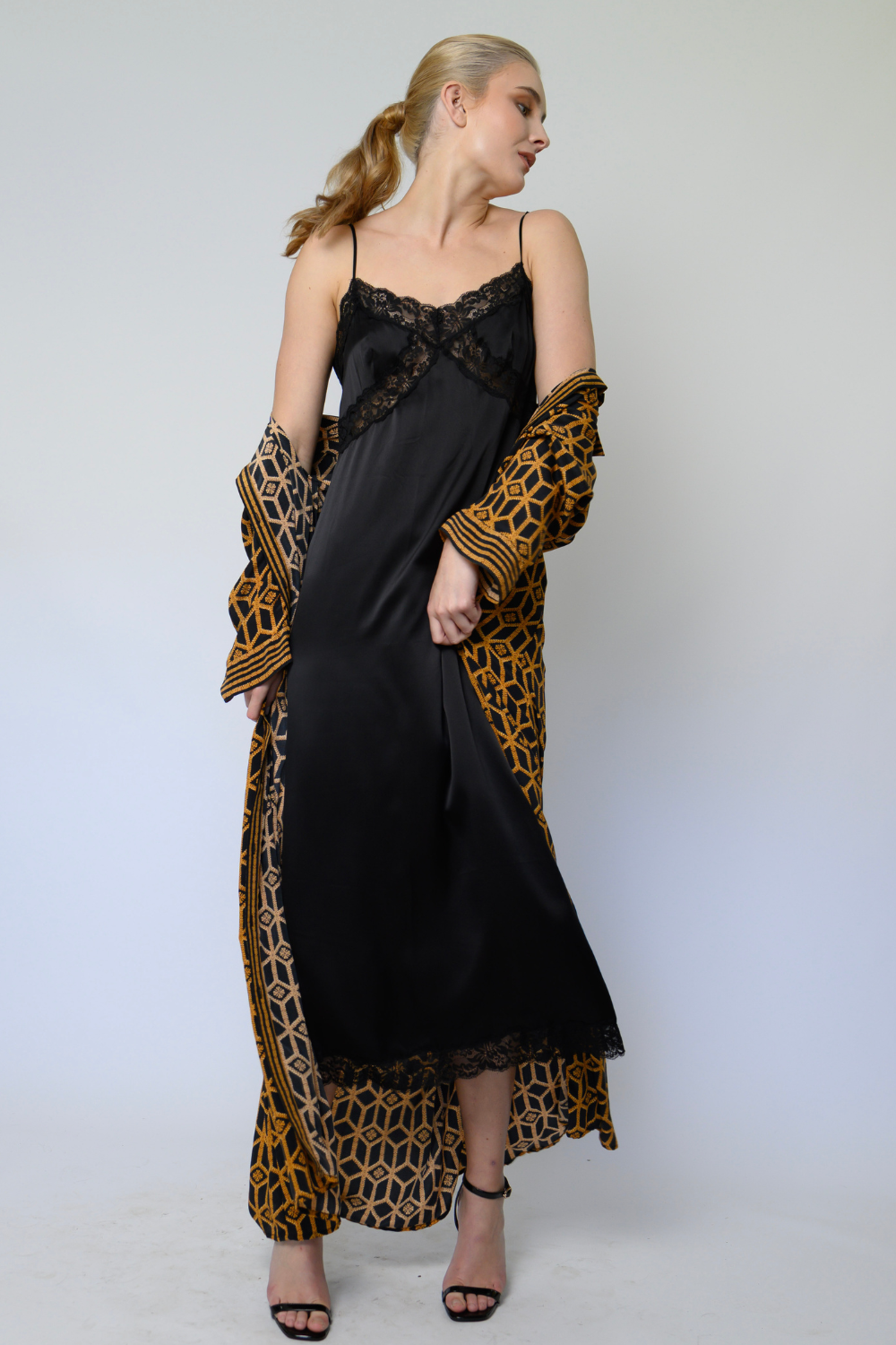 women’s silk satin slip dress with lace trim, spaghetti straps and peep-through detail under the bust in black or soft pink, on sale